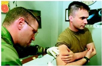 An American soldier receiving an anthrax vaccine before shipping out to Korea in February 2000. Inhalation of anthrax spores causes severe respiratory distress, shock, and death in about five days.
